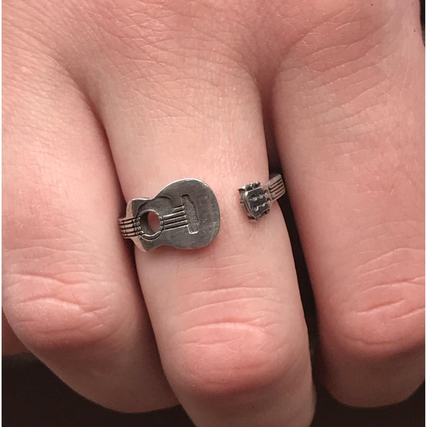 Guitar Player Inspire Ring on finger