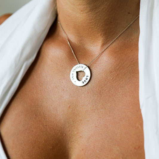 woman wearing love blessing ring as a necklace