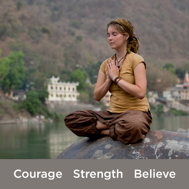 Woman meditating with courage strength believe