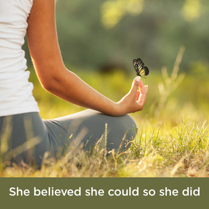 Woman in field with butterfly on fingers