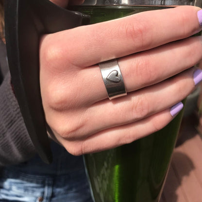 Woman wearing Hearts of Gold LOVED Ring