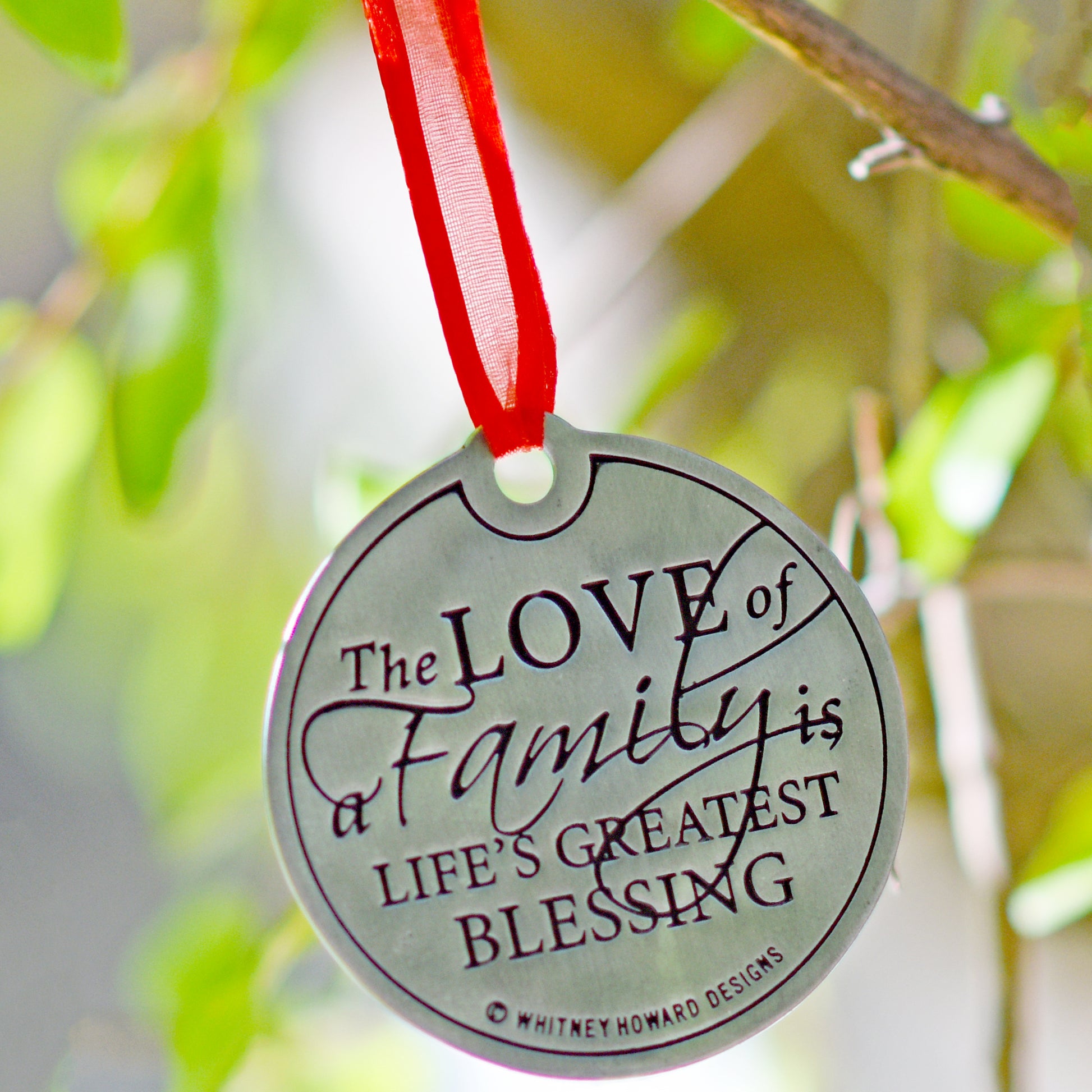 The Love of a Family is Life's Greatest Blessing Holiday Ornament hanging closeup